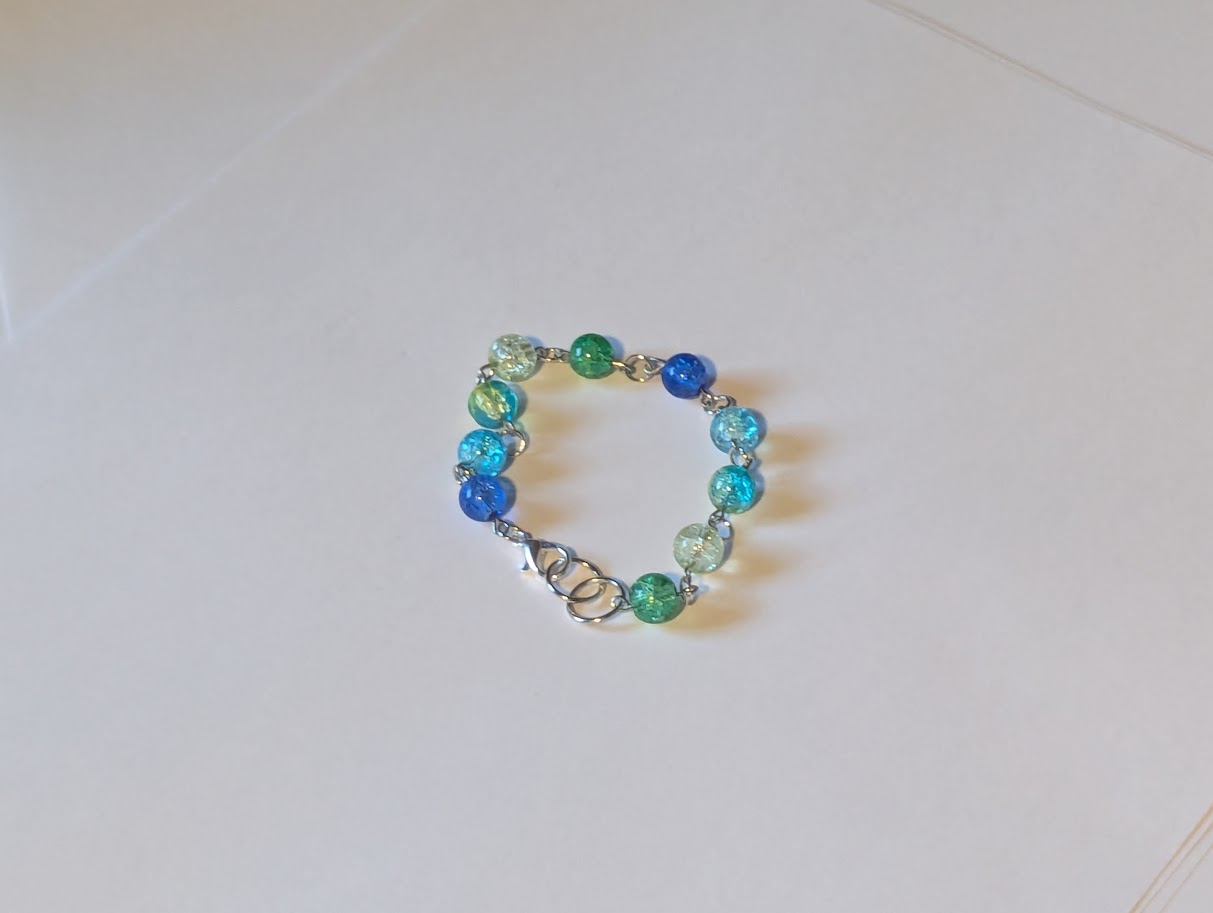 a Green and blue charm bracelet